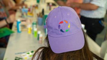 LGBTQIA+RC student wearing hat
